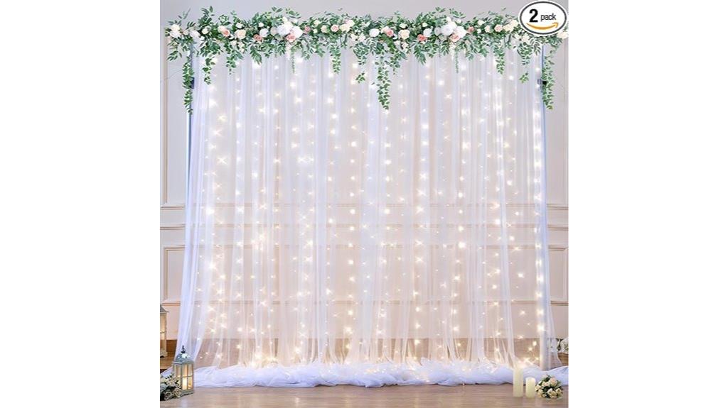 white tulle backdrop with lights
