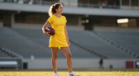 Why Taylor Swift Wore a Yellow Minidress to Support Travis Kelce at Tight End University